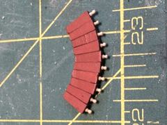 The ten quoins with turned handles, painted red