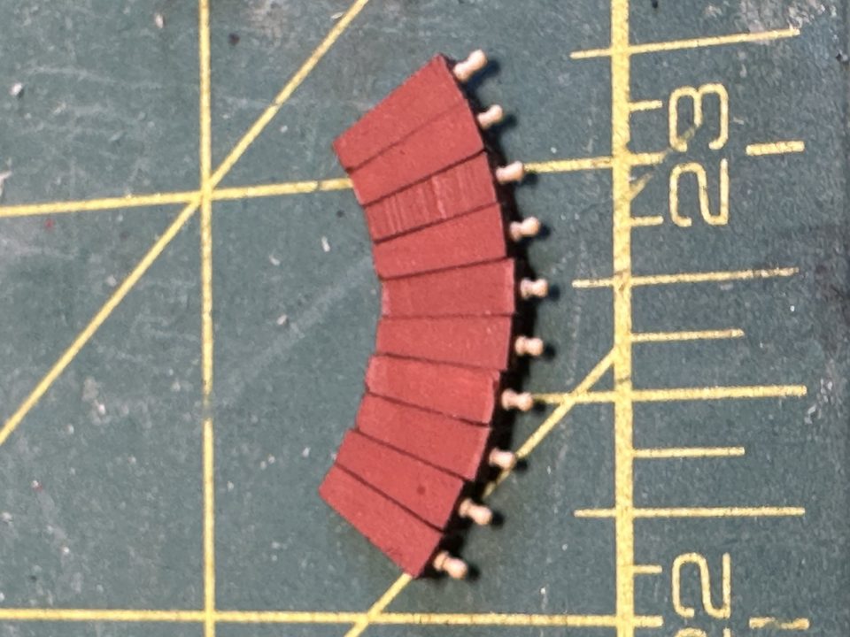 The ten quoins with turned handles, painted red