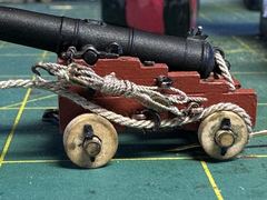 The first gun tackle, with the fall frapped around it instead of coiled on the deck