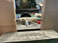 The jig: two blocks in the vice with a small hook, the tackle taking shape between them