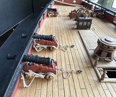 The same guns from the other side, with the coiled ends on the deck