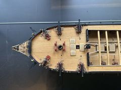 The forecastle from above, with the carronades on their slides and the 9-pounders behind them