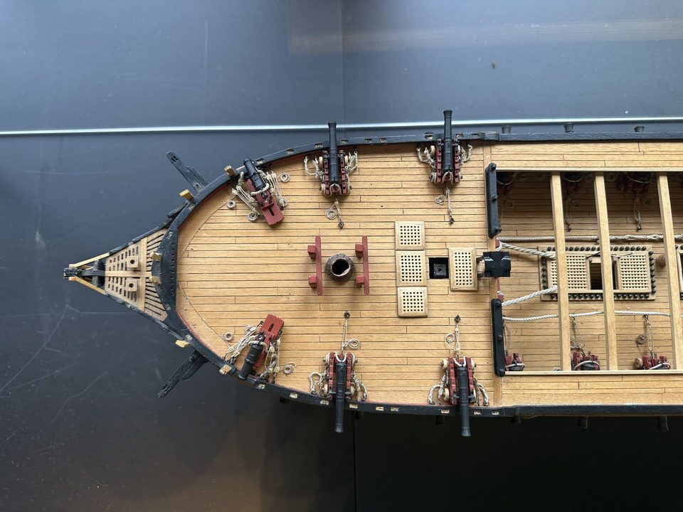 The forecastle from above, with the carronades on their slides and the 9-pounders behind them