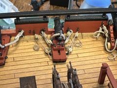 A rigged carronade close up, with breeching, gun tackles and the elevating screw
