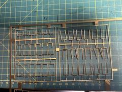 The hammock cranes from the kit on their etched sheet, mostly bent or broken off