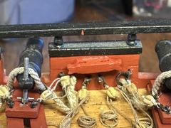 The modified cavel cleat between two guns on the upper deck