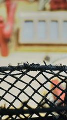 The small whipping that holds the netting to the horizontal rope