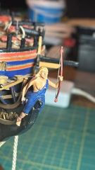 From the other side: the hair, the quiver on her back and the belt over the shoulder