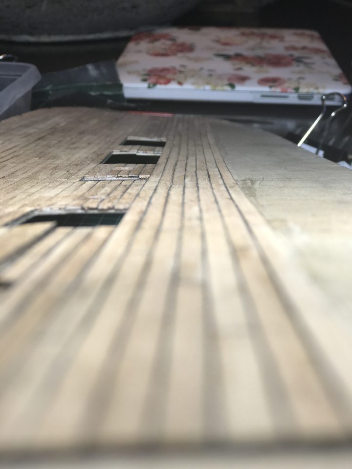 Raking light shows the unevenness in the deck best.