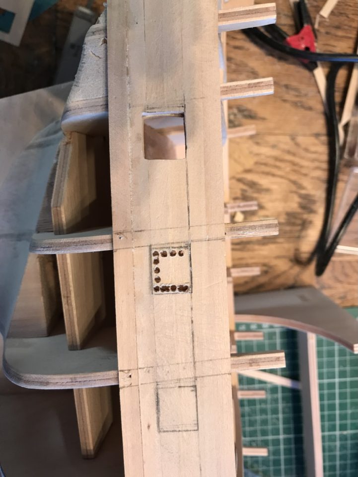 Seen from inside: the row of holes along the outline of a port.