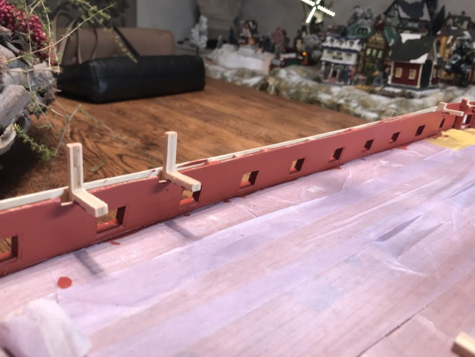 The inner bulwark after the second coat, with the deck still covered.