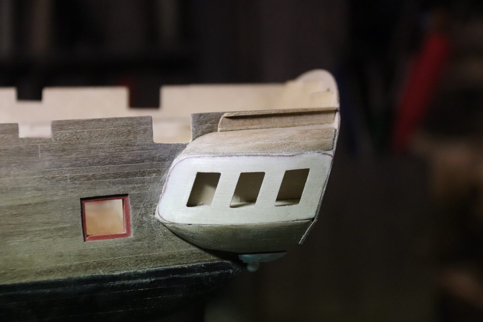 The gallery with the three openings cut out: a small frame for the plastic to drop into.