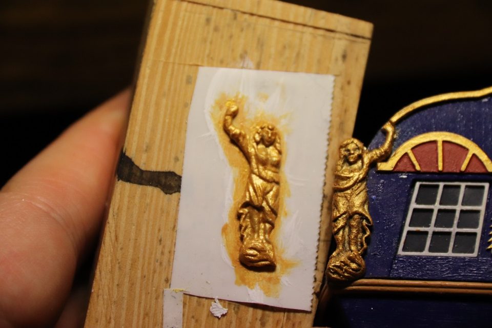 The figure on a piece of tape on a block, next to the transom to compare the colour.
