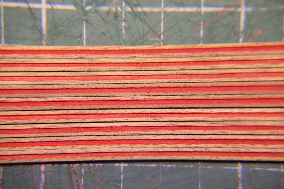 The mouldings close up: the red sits in the groove, the top of the profile stays clean.