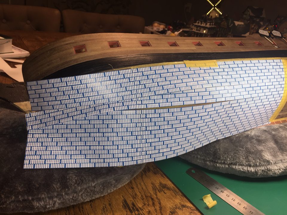 The printed sheet of full-size plates, stuck together and cut into strips.