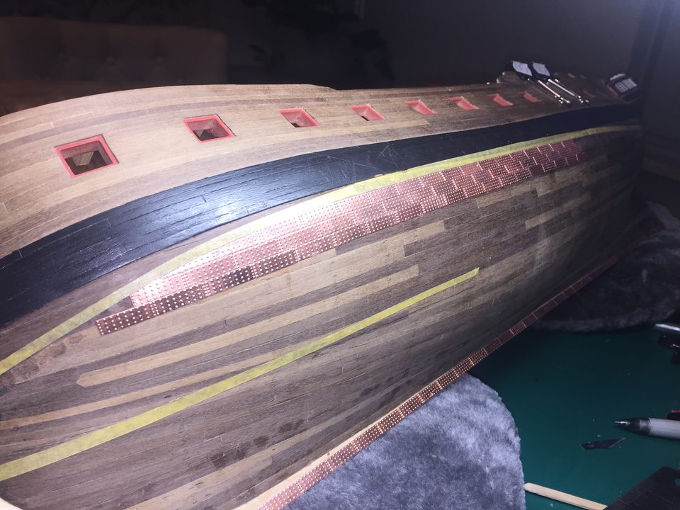 The first rows below the waterline, running neatly with the yellow belts.
