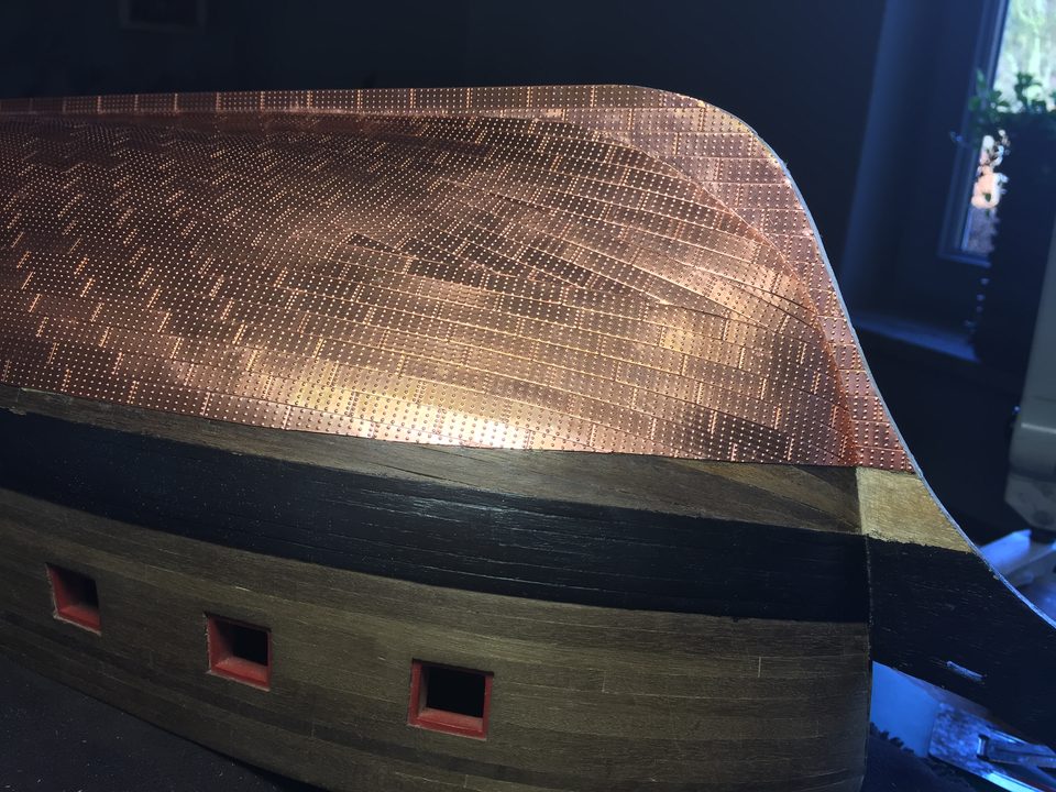 The ship upside down: amidships the copper runs right down to the keel, with as many whole plates as possible.