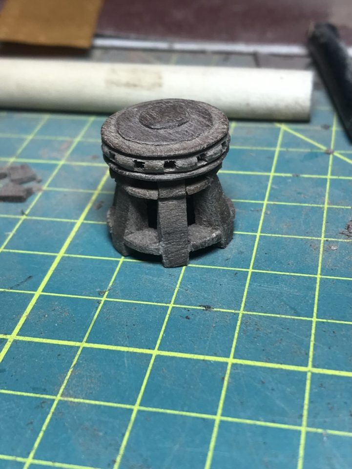 The complete capstan with drumhead, thick whelps and wedges on the cutting mat.