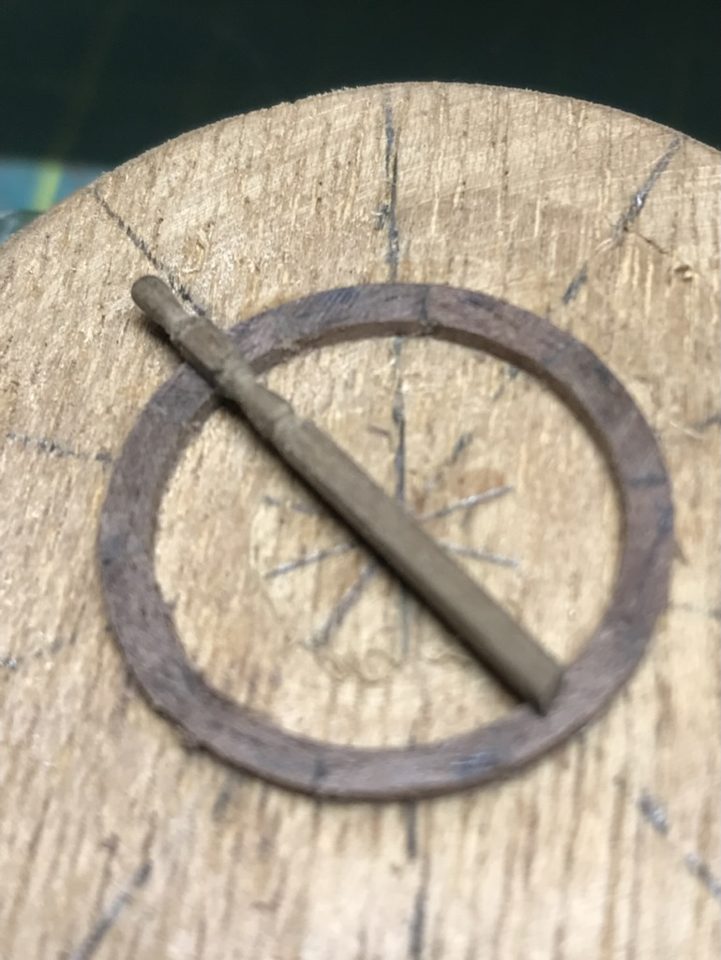 The turned rim on the disc, with a trial strip across the centre to check the spoke direction.